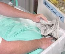Crumpled
        newspapers and foam peanuts are used to fill the voids and cushion the rock.