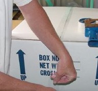 The sealed
        styrofoam box is placed in the cardboard box which is closed and sealed.