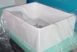 The styrofoam box is lined with a large sheet of heavy plastic film.